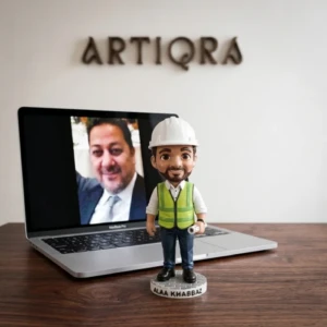 Our Work 12 Personalized engineer chibi figurine wearing a safety helmet and reflective vest while holding a blueprint, made by Artiqra.
