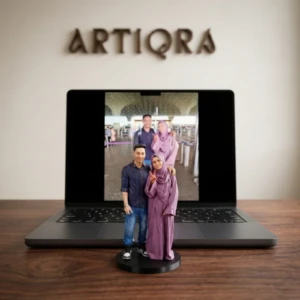 Our Work 40 Personalized hand-painted 3D couple portrait figurine in casual wear and abaya crafted by Artiqra UAE.