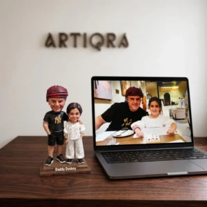 Our Work 52 Custom father and daughter bobblehead sculpture titled Daddy Donkey, recreated from their personal photograph by Artiqra.
