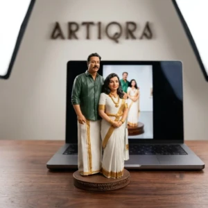 Our Work 27 Custom South Indian anniversary couple 3D lifelike resin figurine in traditional saree and dhoti by Artiqra UAE.